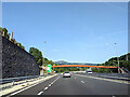 Junction on the A465 and rust finished footbridge