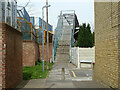 Steps up to footbridge over Ilford Depot, 2011