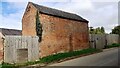 Red Lodge Farm outbuilding on NW side of Hoby Road