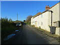 SE2590 : Minor road and cottages at Kirkbridge by Peter Wood