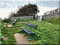 Seats and signs by Coastguard Cottages path, Dawlish