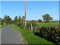 Church Lane, with stile and footpath sign, Alvington, Gloucestershire