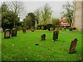 SE2599 : Grave headstones in the churchyard, Bolton-on-Swale by Humphrey Bolton