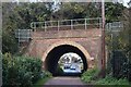 Arch through railway embankment, leading to St George