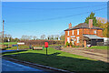 Langley Lower Green: signpost, postbox and pub