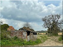 TM3558 : Abandoned barns, Beversham Road, Glemham by Simon Mortimer