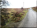 Llwybr yn gadael yr heol / Path exits the road