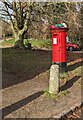 Colourful hat on a pillarbox, Goodrich, Herefordshire