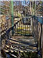 Rotten decking on boarded-off bridge over the Burren in Islands Park