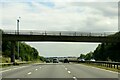 The M27 heading east under a footbridge