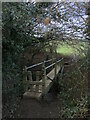 A footbridge with stile