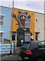 Orreste the Racoon, on a house at The Nursery