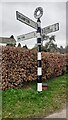 Cumberland County Council finger signpost at T-junction NE of Lanercost Priory