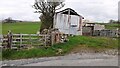 Field gateway and ramshackle farm building on north side of Brackenley Lane