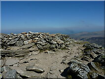 SH6359 : Walkers' summit cairn & shelter on Y Garn by Richard Law