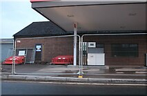 SO7119 : Closed garage on the A40, Huntley by David Howard