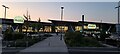 SP5179 : Rugby service station, sunset light by Christopher Hilton