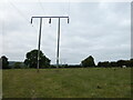 Power lines cross the minor road east of Llanymynech