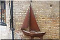 View of a model of a boat outside a studio in Trinity Buoy Wharf