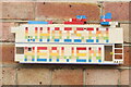 View of a Lego Who Is In Heaven model on the side of a studio in Trinity Buoy Wharf