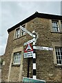 Direction Sign – Signpost at crossroads in Norton St Philip