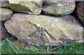 Benchmark cut into stone in roadside wall, Nidderdale