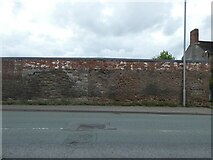 SJ2572 : Old stone and brick wall, Chester Road, Flint by David Smith