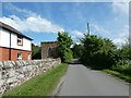 House and stone building by NCN568 north of Burton Marsh