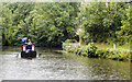 Canal boat approaching the Three Rise Locks at Bingley