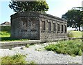 Brick building beside the shore