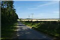 Road beside Etton West Wood