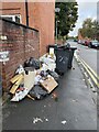 SJ9399 : Rubbish in street by Paul Foster