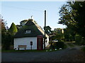 South Willingham. Woodbine Cottage and the entrance to the church