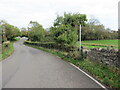 Llwybr yn gadael yr heol / Path exiting the road