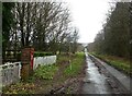 SE9878 : Minor road from the level crossing towards the A64 by JThomas