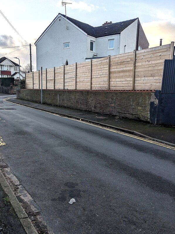 wooden-fence-on-a-brick-wall-pillmawr-jaggery-geograph-britain