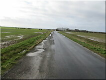 TA3821 : Water logged road and land at Out Newton by Peter Wood