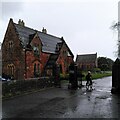 Cycling home through a cemetery in the rain