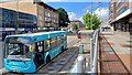 Blue bus under a blue sky