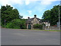 The former gatehouse, with associated walls & gatepiers, to Linnwood Hall