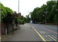 Bus stop and shelter on Wilmslow Road (A5145)