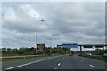 Motorway sign gantry over M53 in advance of exit for Wallasey