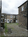 A courtyard off Halifax Road (A628), Staincliffe, Batley