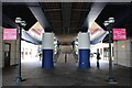 View along the underside of the DLR bridge into Canary Wharf station from near Cabot Place