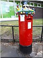 Yarn bombed postbox outside Sandbach Library