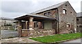 Barn conversion on south side of road at Hollin Root