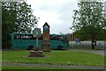 Beetley village sign and village clock, outside the school