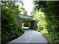 Railway bridge over road from golf course