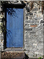 Blue door and a benchmark, Mount Pleasant, Conwy