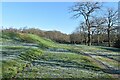 Grassy embankment around covered reservoir at Otterbourne